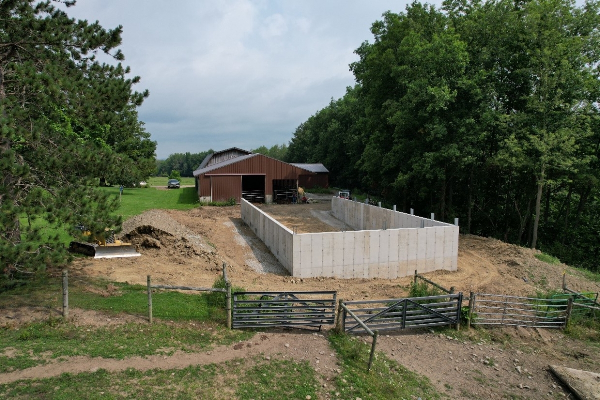 concrete foundation and walls poured for a covered waste storage system at Mekka Jo Farms